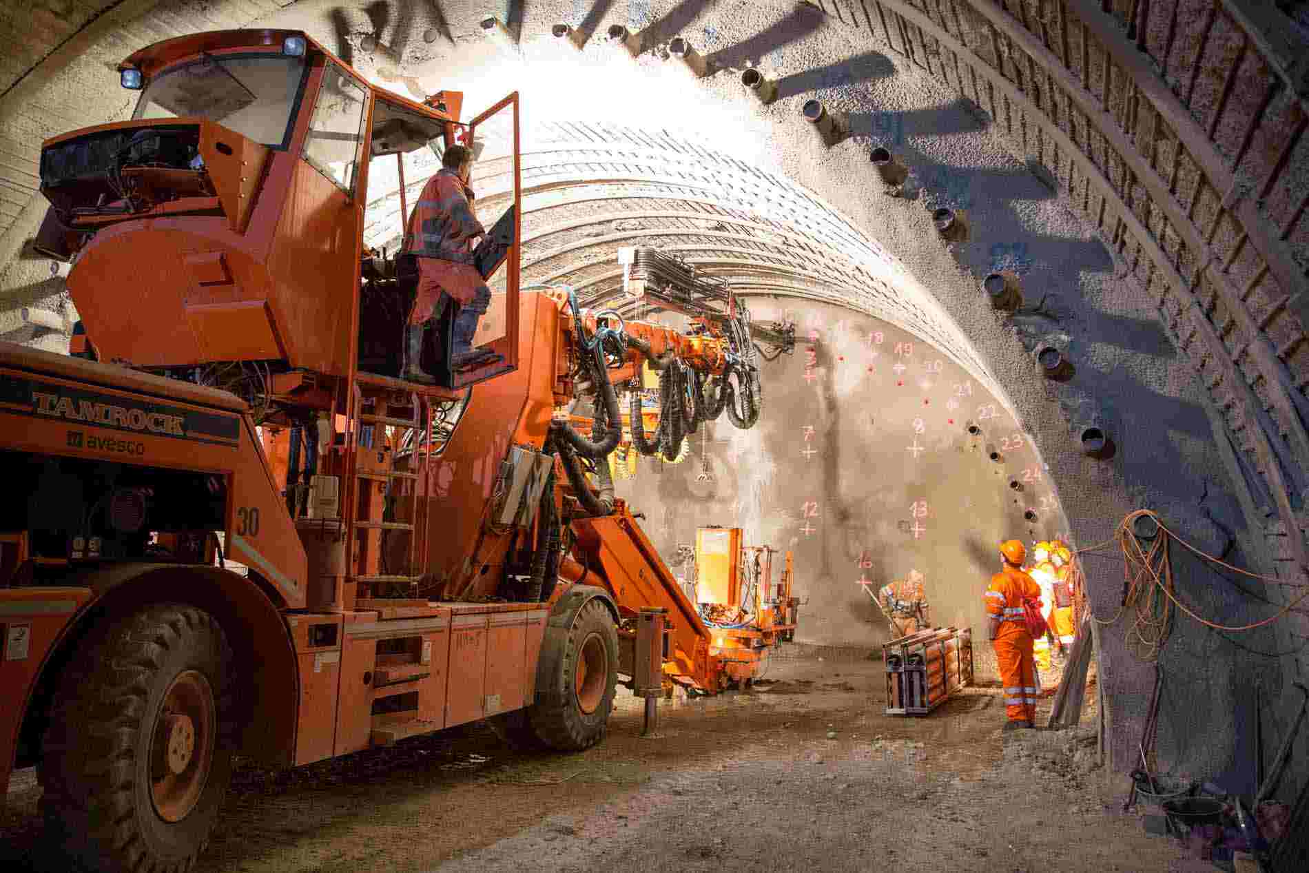 tunnel with large equipment and workers