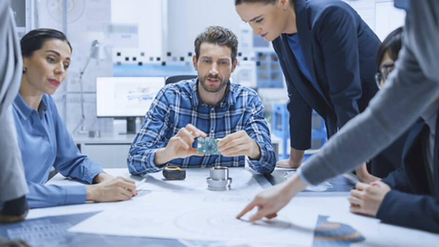 group of engineers looking at diagrams