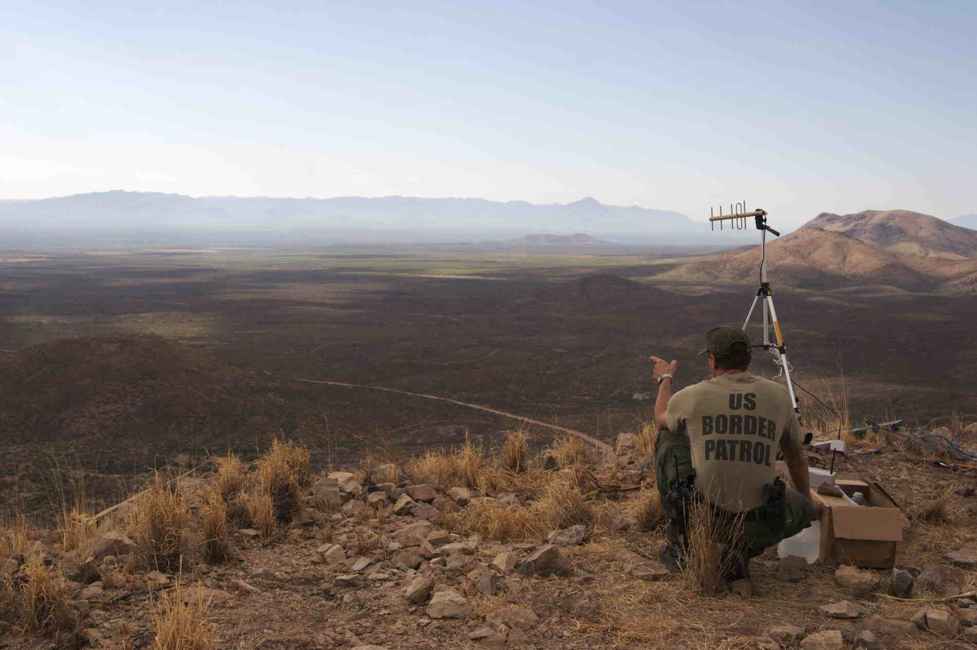 US Border Patrol agent looks over vast terrain with IWT equipment installed