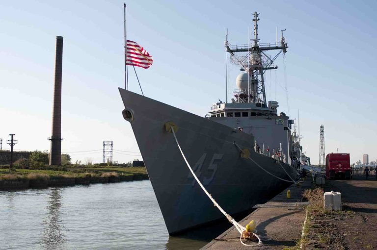 Navy ship docked at pier