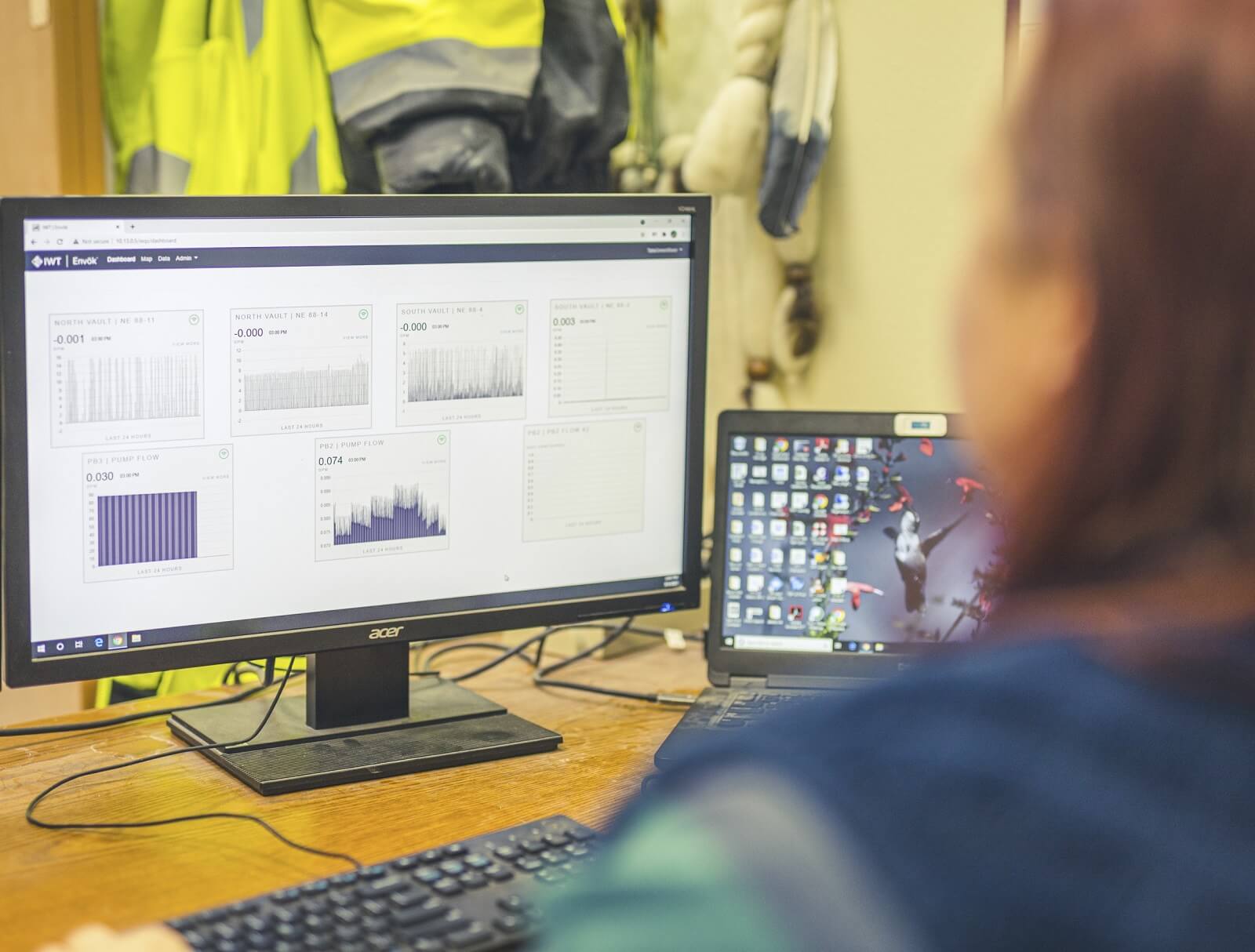 Worker reviews remote tailing information on screen